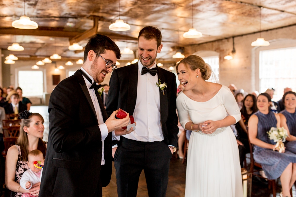 bride and groom laughing during the ceremony