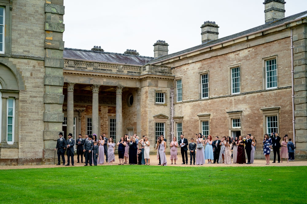 guest waiting for couple to arrive outside Compton Verney