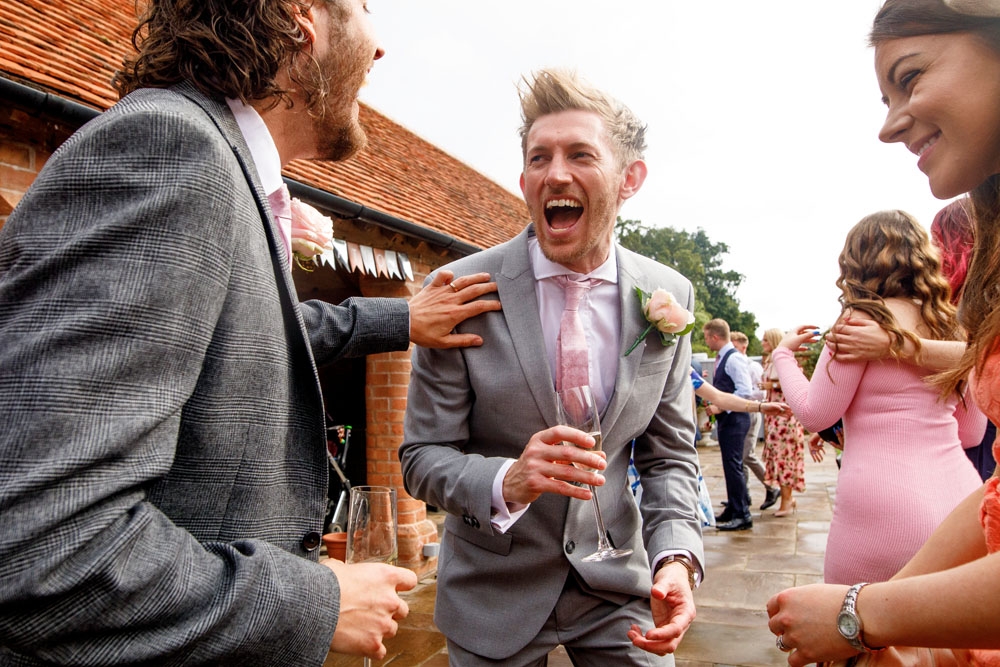 guests laughing during drinks reception