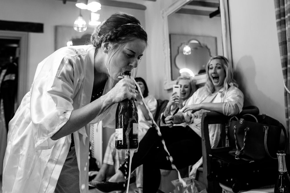 bride drinking champagne