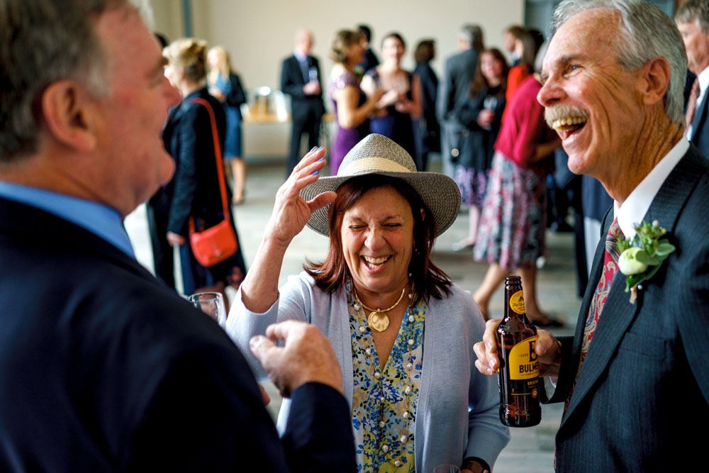 guests laughing during drinks reception