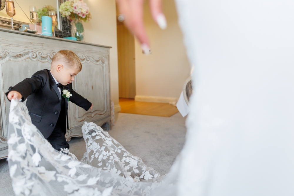 little boy helping the bride 