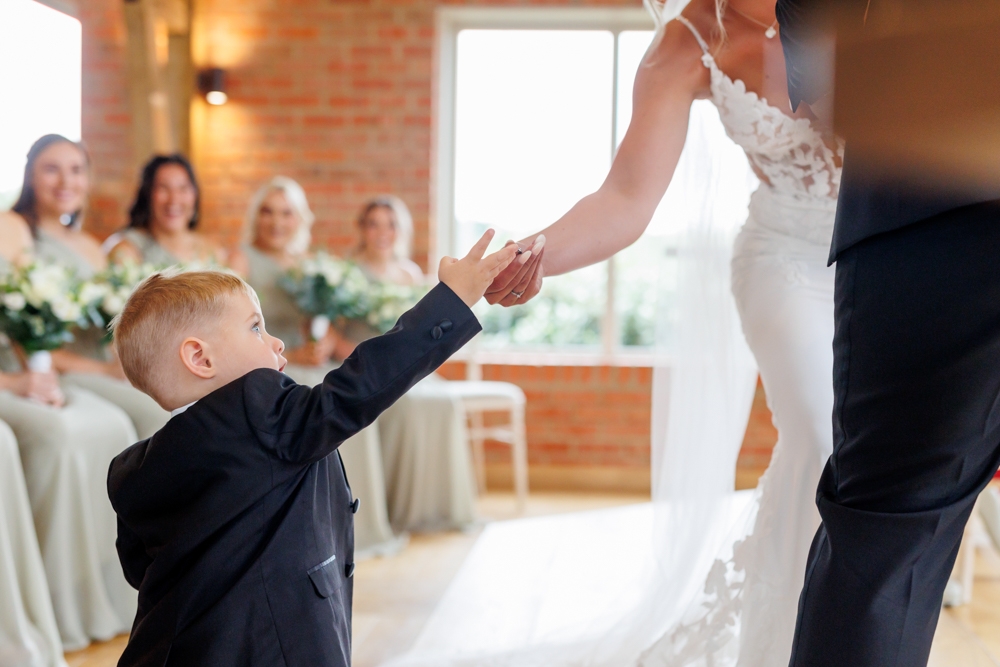 little boy giving the ring 
