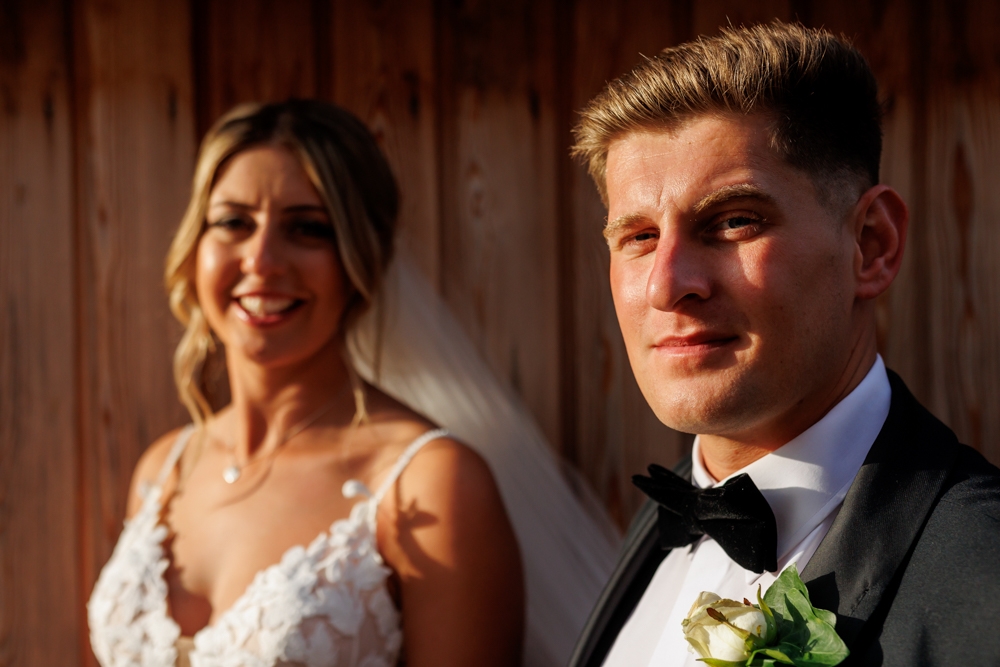 bride and groom smiling together 