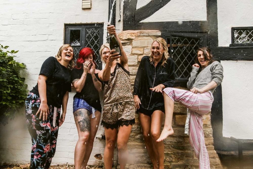 bridal party drinking champagne