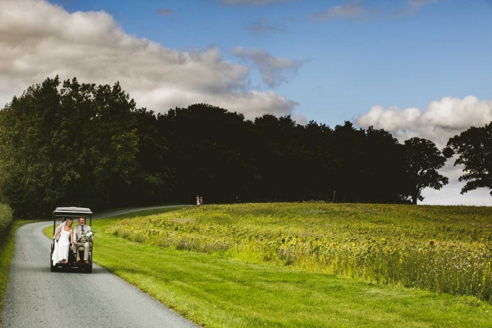 bride and dad taking the buggy to the top of the isle