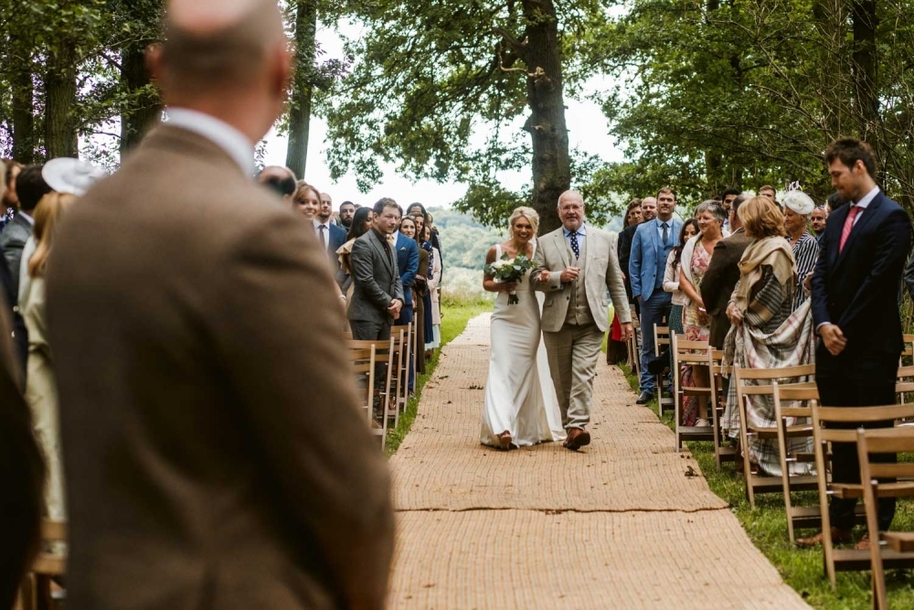 groom waiting for the bride to walk down the isle