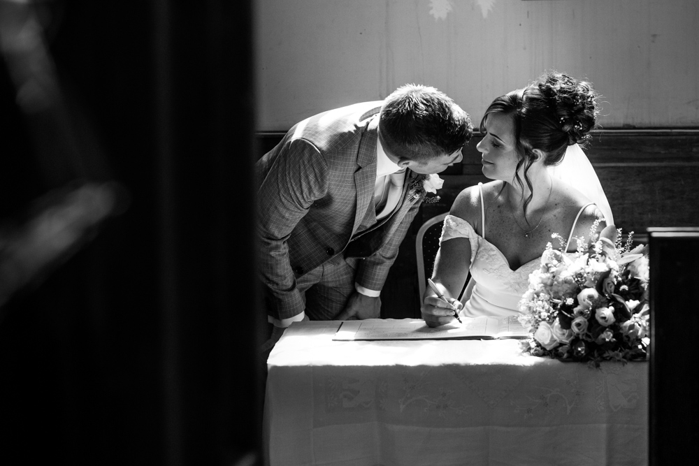 bride signing the register 