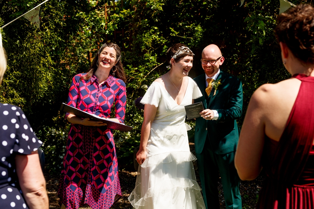 bride and groom laughing during ceremony