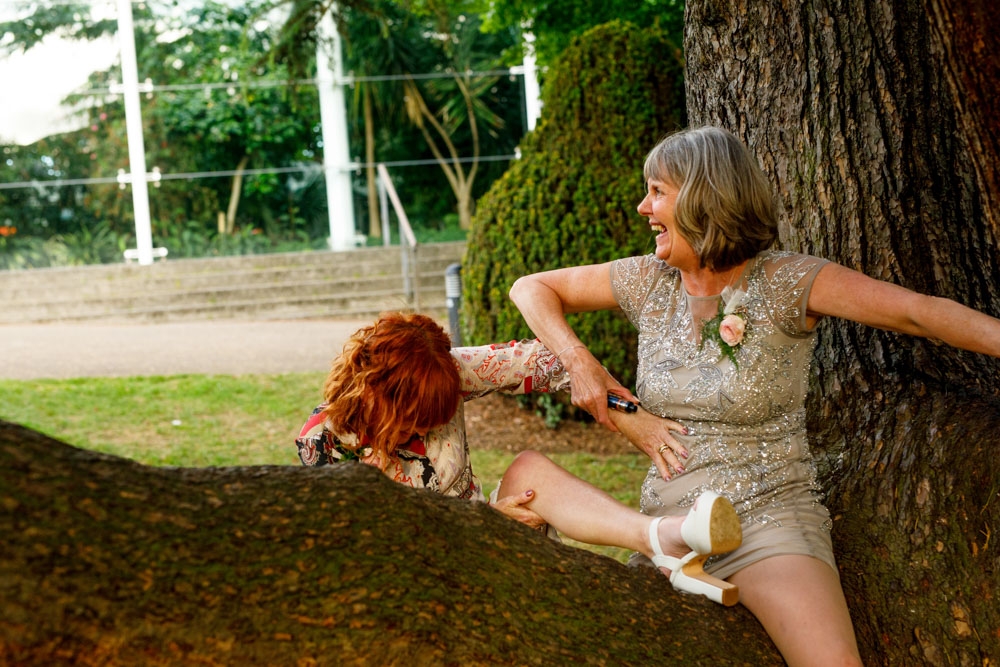 bride and grooms mums climbing the trees 