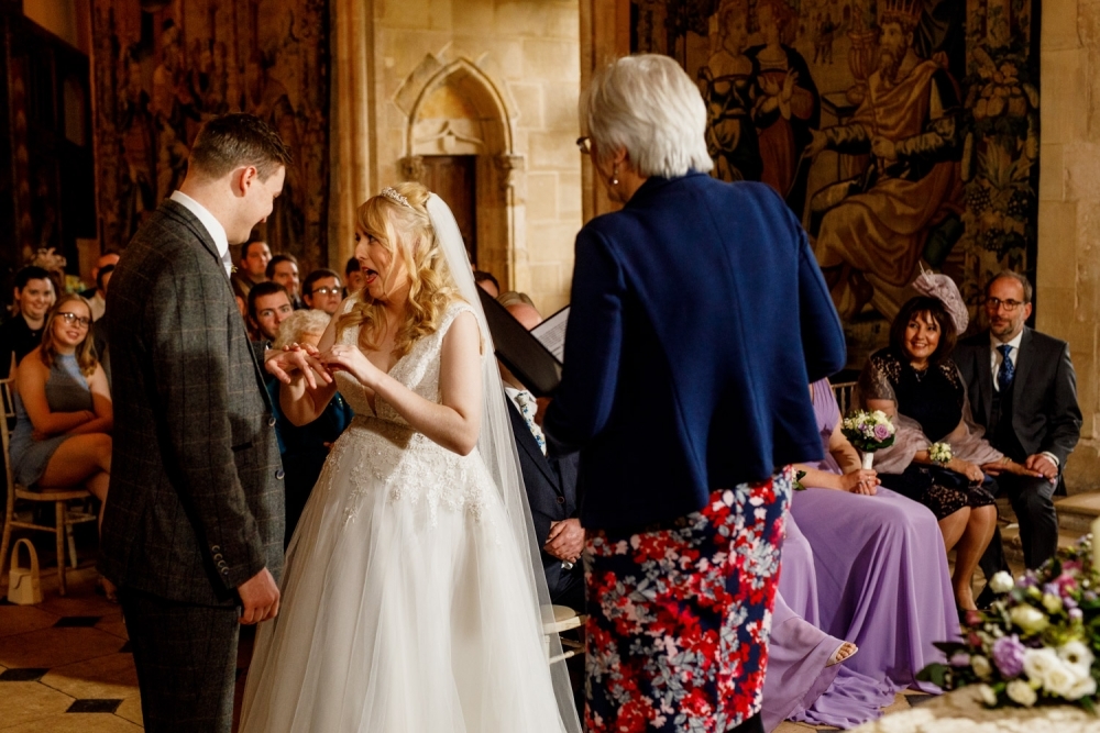 bride and groom laughing during ceremony