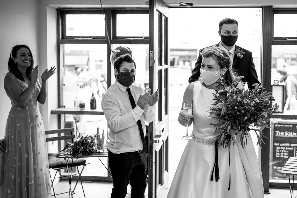 bride and groom entering the room 