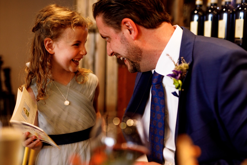 groom smiling with his daughter