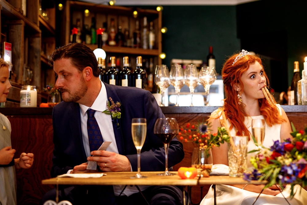 bride and groom laughing 