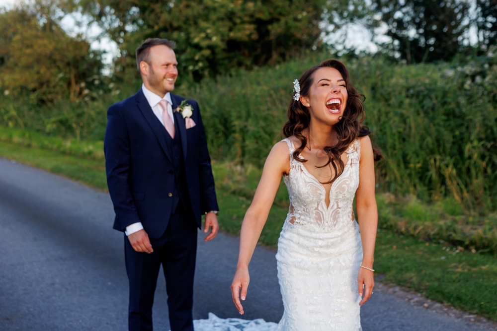 bride and groom laughing 