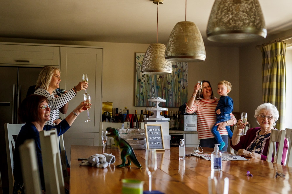 everyone raising a glass of bubbly