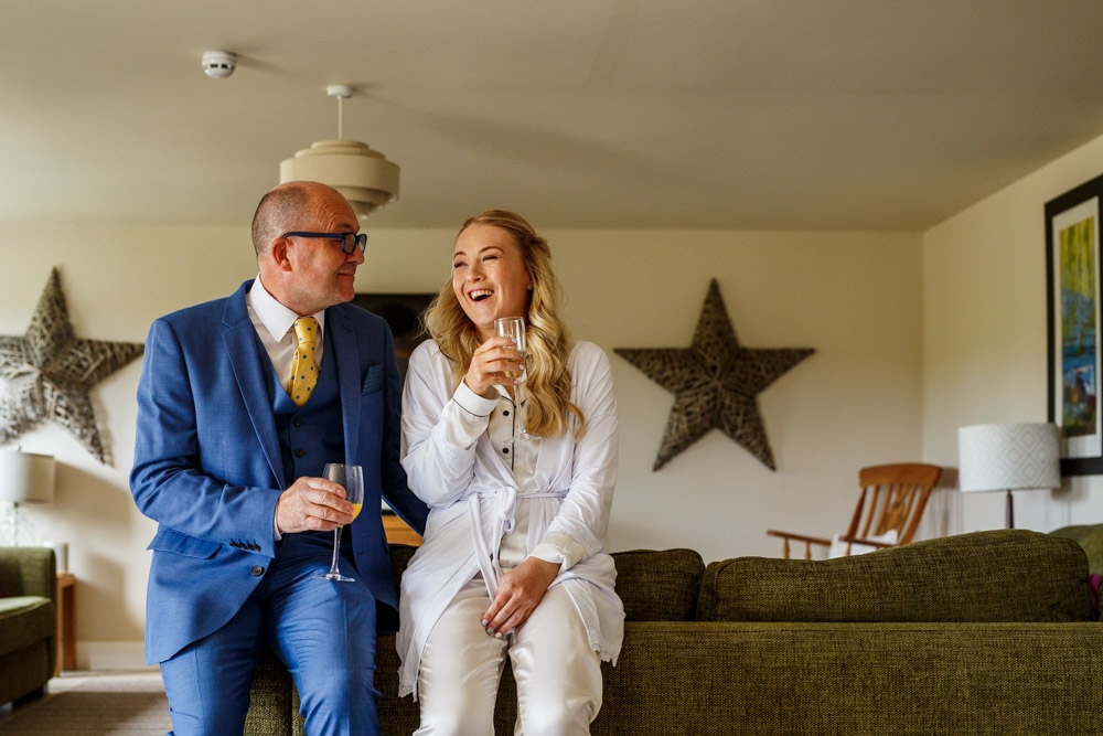 dad and daughter sharing a drink 