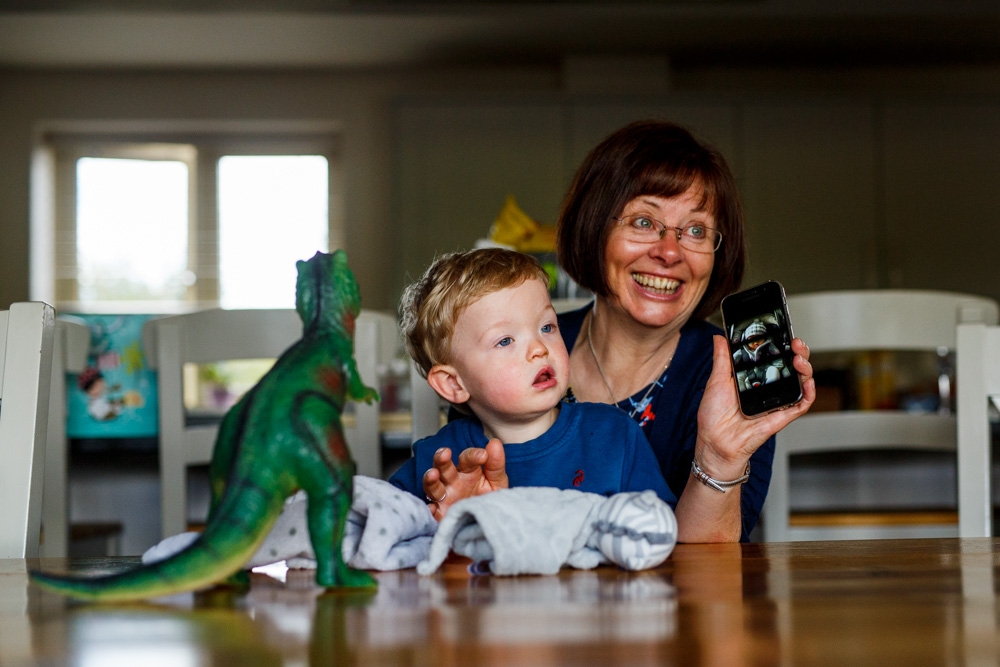 grandma and child playing on the phone