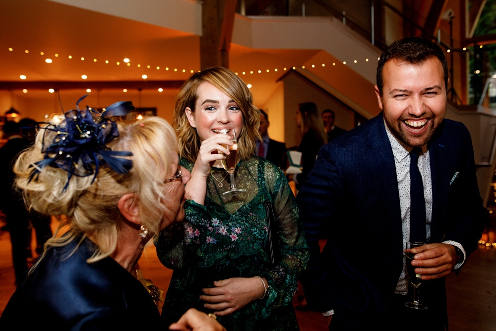 friends laughing during wedding breakfast