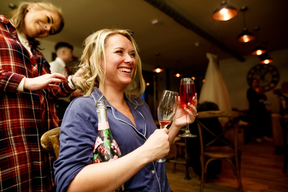 bride drinking champagne