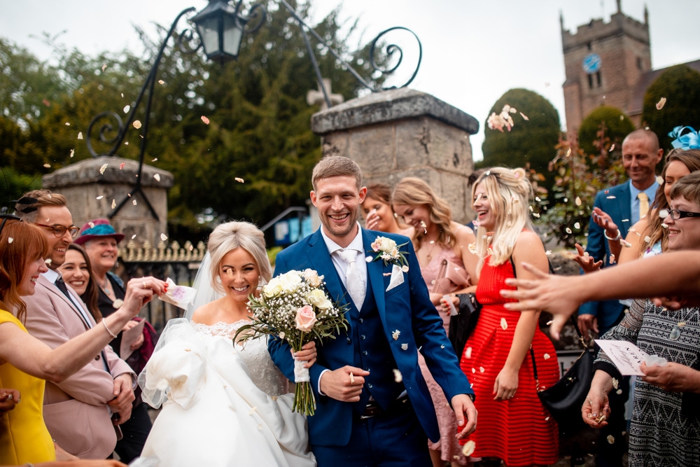 bride and groom leaving church