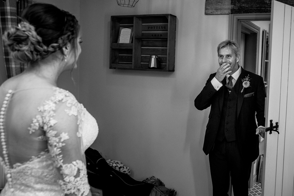 dad seeing her daughter in her wedding dress