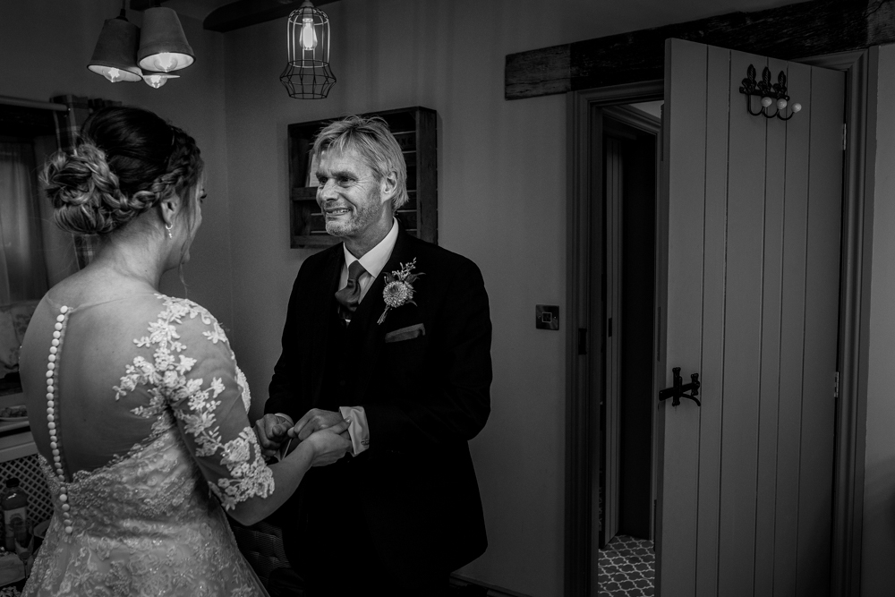 bride and dad hugging