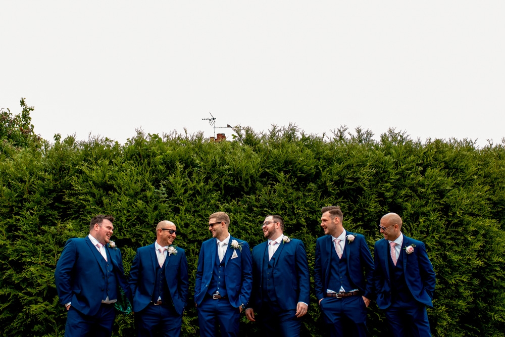 grooms men heading to church 