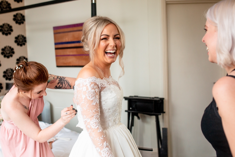 bride getting into her dress