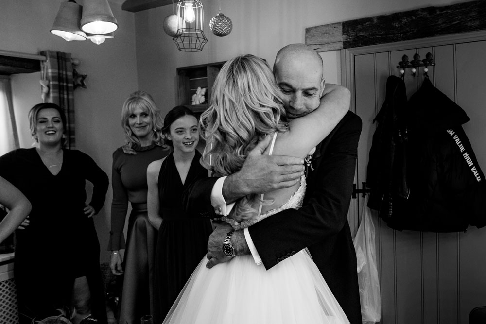 bride and dad hugging