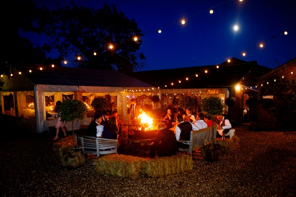 guests drinking outside at sunset