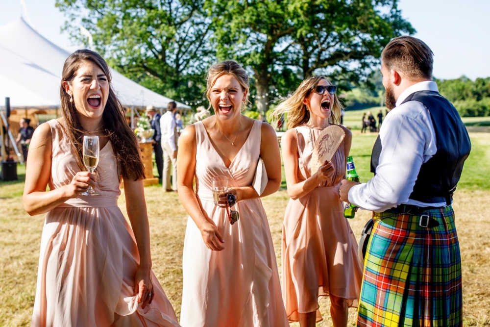 wedding guests laughing