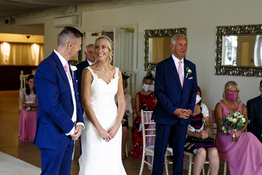 bride joins groom at the top of the isle