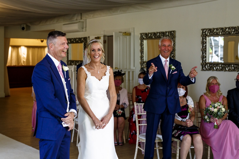 bride and groom laughing