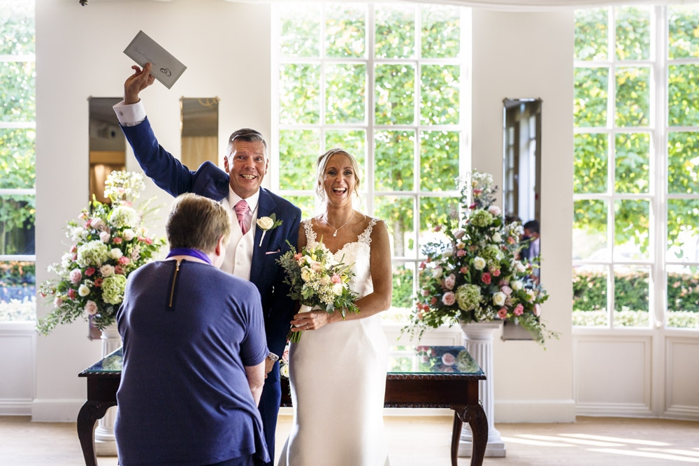 bride and groom walking down the isle