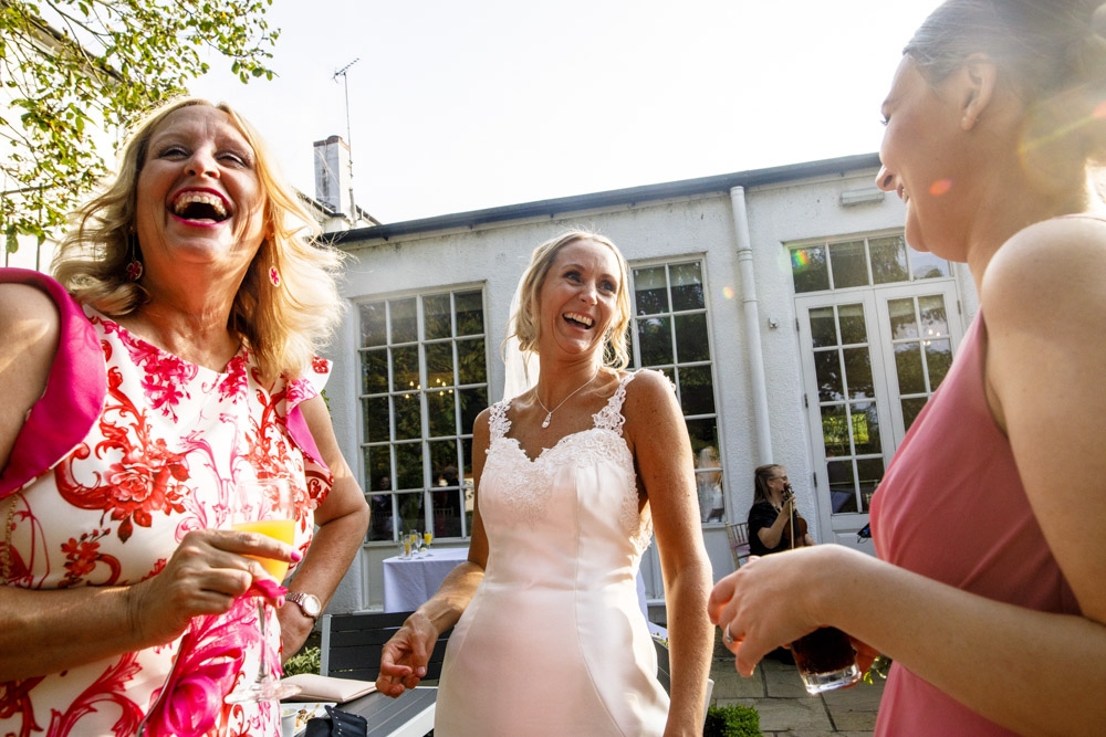 friends laughing during wedding breakfast