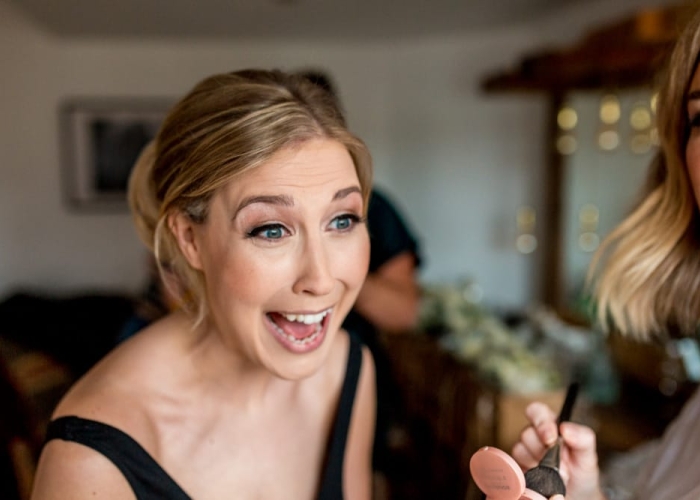 Bride laughing during bridal prep